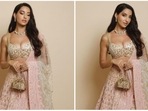 Nora Fatehi's latest look in a blush pink customised lehenga set by one of India's most celebrated designers Manish Malhotra will surely speed-up your heartbeats.(Instagram/@manishmalhotra05)