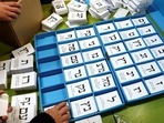 Israel Elections: Officials sort ballot papers just before the station opens for voting.
