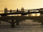 Storm Claudio In UK: City workers cross the Millennium Bridge as they commute to work in London, UK.(Bloomberg) Storm Claudio In UK: City workers cross the Millennium Bridge as they commute to work in London, UK.(Bloomberg)