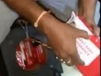 A video shared by the chief minister showed the police taking out the baby wipe packets from the sound box and further tearing the packets to reveal the drug-filled soap cases.(Twitter screengrab)