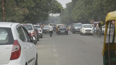Vehicles illegally parked along a main road in Ghaziabad on Tuesday. (Sakib Ali/HT Photo)