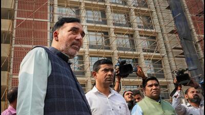 Delhi environment minister Gopal Rai at the site of the BJP offices. (PTI) Delhi environment minister Gopal Rai at the site of the BJP offices. (PTI)