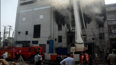 Fire services personnel at the site of the blaze. (HT Photo) Fire services personnel at the site of the blaze. (HT Photo)
