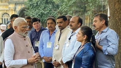 Prime Minister Narendra Modi meets the people who were involved in the rescue and relief operations of the cable bridge collapse mishap. (Pradipsinh Jadeja Twitter/ ANI)