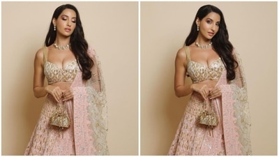 Nora Fatehi's latest look in a blush pink customised lehenga set by one of India's most celebrated designers Manish Malhotra will surely speed-up your heartbeats. (Instagram/@manishmalhotra05) Nora Fatehi's latest look in a blush pink customised lehenga set by one of India's most celebrated designers Manish Malhotra will surely speed-up your heartbeats. (Instagram/@manishmalhotra05)
