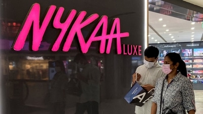 People walk past a store of Nykaa at a mall in New Delhi. (Reuters)
