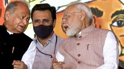 PM Modi and Ashok Gehlot share stage during the event on the Mangarh massacre. (PTI) PM Modi and Ashok Gehlot share stage during the event on the Mangarh massacre. (PTI)