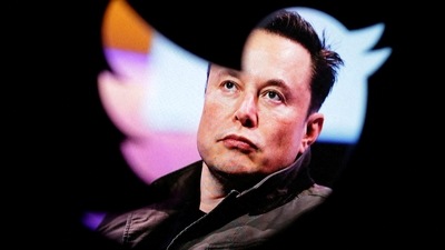 FILE PHOTO: Elon Musk's photo is seen through a Twitter logo in this illustration. (REUTERS)