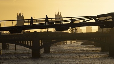 Storm Claudio In UK: City workers cross the Millennium Bridge as they commute to work in London, UK. (Bloomberg) Storm Claudio In UK: City workers cross the Millennium Bridge as they commute to work in London, UK. (Bloomberg)