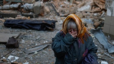 Russia-Ukraine War: A woman reacts next to the body of her neighbour found under debris of a residential house. (Reuters)