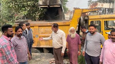 MC team initiating road repair and patchwork drive in Ludhiana. (HT PHOTO)