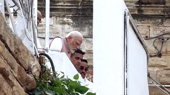Prime Minister Narendra Modi with Gujarat Bharatiya Janata Party (BJP) chief CR Paatil and state minister of state for Home Harsh Sanghavi during inspecting the accident site.(ANI)