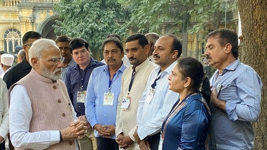 Prime Minister Narendra Modi meets the people who were involved in the rescue and relief operations of the cable bridge collapse mishap.(Pradipsinh Jadeja Twitter/ ANI)