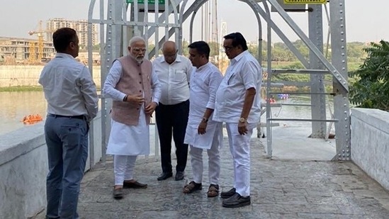 The PM arrived at Darbargadh Palace where he was briefed by officials about what might have gone wrong with the bridge.(CMO Gujarat Twitter)