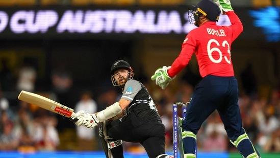 Kane Williamson plays a sweep shot during the ICC T20 World Cup 2022 match between England and New Zealand at The Gabba(AFP)
