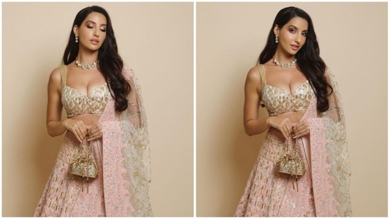 Nora Fatehi's latest look in a blush pink customised lehenga set by one of India's most celebrated designers Manish Malhotra will surely speed-up your heartbeats.(Instagram/@manishmalhotra05)