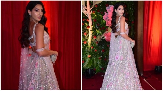 Nora Fatehi earlier dropped jaws at a Diwali bash in an embellished ivory lehenga set teamed with a backless blouse.(HT Photo/Naziyah Khan)