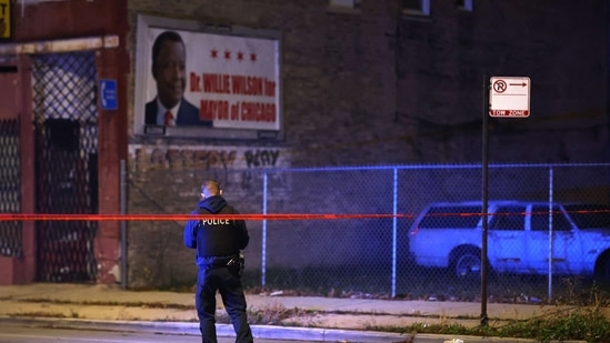 Chicago Halloween Shooting: Police investigate the scene where as many as 14 people were reported to have been shot. (AFP)