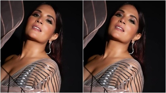 Richa’s white saree came in silver metallic stripes throughout. She further teamed it with an off-shoulder silver corset blouse with a plunging neckline and overlapping patterns. (Instagram/@therichachadha)