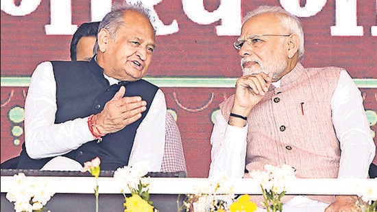 Prime Minister Narendra Modi interacts with Rajasthan chief minister Ashok Gehlot in Banswara on Tuesday. (ANI)