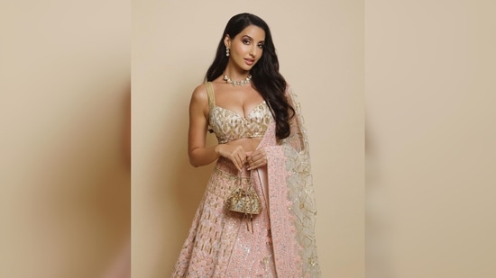 Nora Fatehi's look was put together by celebrity stylist Aastha Sharma. Nora wore this outfit to Manish Malhotra's Diwali bash.(Instagram/@manishmalhotra05)
