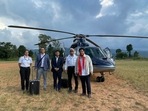 Meghalaya CM Conrad Sangma with the captain and pilot of the helicopter after an emergency landing near Umiam lake due to bad weather. (Twitter: @SangmaConrad) Meghalaya CM Conrad Sangma with the captain and pilot of the helicopter after an emergency landing near Umiam lake due to bad weather. (Twitter: @SangmaConrad)