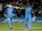Virat Kohli raises his bat after scoring a half-century during the T20 World Cup match between India and Bangladesh, at Adelaide Oval(PTI)