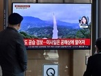 North Korea Missile Launch: People watch a television screen showing a news broadcast with file footage of a North Korean missile test. North Korea Missile Launch: People watch a television screen showing a news broadcast with file footage of a North Korean missile test.