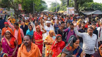 Devotees participate in the annual '14-Kosi parikrama' in Ayodhya on Wednesday. (PTI Photo)