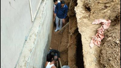 Police said the workers were digging sewer lines outside a house in the residential society and the wall adjacent to the house collapsed. (HT Photo) Police said the workers were digging sewer lines outside a house in the residential society and the wall adjacent to the house collapsed. (HT Photo)
