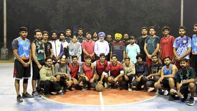 Basketball team players pose for a picture after match being held at PAU in Ludhiana. (HT PHOTO)
