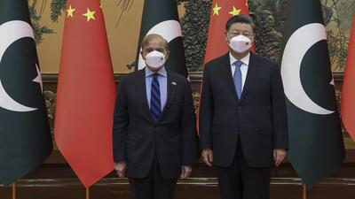 Chinese President Xi Jinping (right) poses with Pakistani Prime Minister Shehbaz Sharif before their meeting at the Great Hall of the People in Beijing, on Wednesday. (AP) Chinese President Xi Jinping (right) poses with Pakistani Prime Minister Shehbaz Sharif before their meeting at the Great Hall of the People in Beijing, on Wednesday. (AP)