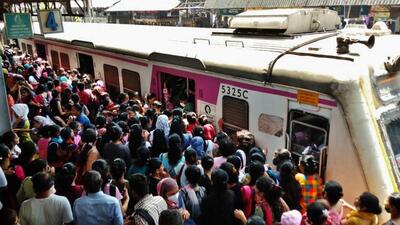 Thane, India - April 16, 2022: Crowd of stranded commuters try to board a local train as trains were running late due to the derailment of the three coaches of 11005 Dadar-Puduchery Express last night, at Thane station, Mumbai, India, on Saturday, April 16, 2022. (Praful Gangurde/HT Photo) (HT PHOTO) Thane, India - April 16, 2022: Crowd of stranded commuters try to board a local train as trains were running late due to the derailment of the three coaches of 11005 Dadar-Puduchery Express last night, at Thane station, Mumbai, India, on Saturday, April 16, 2022. (Praful Gangurde/HT Photo) (HT PHOTO)