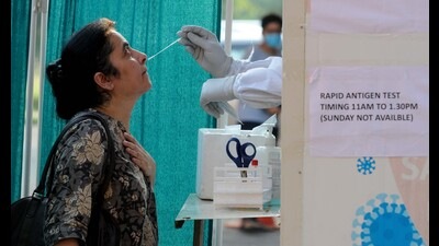 A woman getting tested for Covid-19 in Chandigarh. (Keshav Singh/HT)