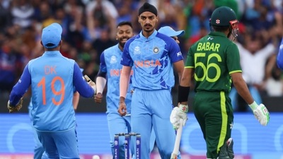 India's Arshdeep Singh, centre, reacts after dismissing Pakistan's Babar Azam (AP)