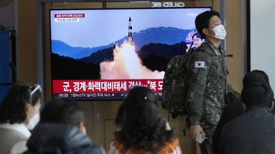 A South Korean army soldier passes by a TV screen showing a file image of North Korea's missile launch during a news program at the Seoul Railway Station in Seoul, South Korea, Wednesday, Nov. 2, 2022. (AP) A South Korean army soldier passes by a TV screen showing a file image of North Korea's missile launch during a news program at the Seoul Railway Station in Seoul, South Korea, Wednesday, Nov. 2, 2022. (AP)