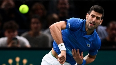 Serbia's Novak Djokovic returns the ball during the men's singles match against US' Maxime Cressy (AFP) Serbia's Novak Djokovic returns the ball during the men's singles match against US' Maxime Cressy (AFP)