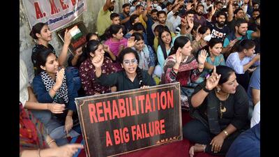 Protesters raise slogans during their agitation seeking relocation from Kashmir over safety concerns, in Jammu on Wednesday. (ANI) Protesters raise slogans during their agitation seeking relocation from Kashmir over safety concerns, in Jammu on Wednesday. (ANI)