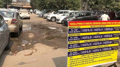 A hoarding showing the new rates at the parking lot near Feroze Gandhi Market on Wednesday. (HT Photo) A hoarding showing the new rates at the parking lot near Feroze Gandhi Market on Wednesday. (HT Photo)