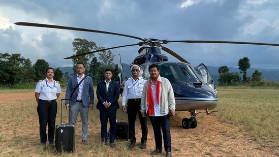 Meghalaya CM Conrad Sangma with the captain and pilot of the helicopter after an emergency landing near Umiam lake due to bad weather. (Twitter: @SangmaConrad)