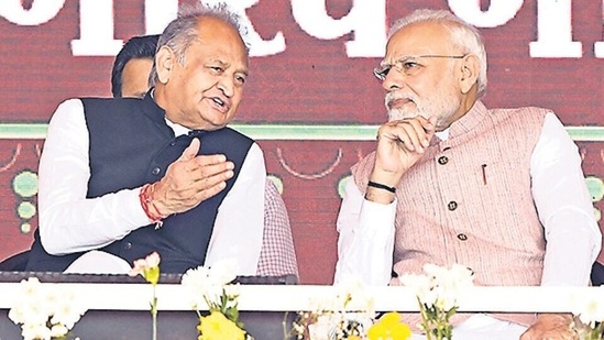 Prime Minister Narendra Modi interacts with Rajasthan chief minister Ashok Gehlot in Banswara on Tuesday. (ANI)