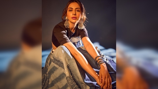 Rakul Preet sat down on the ground and struck boss poses for the gram. (Instagram/@rakulpreet)