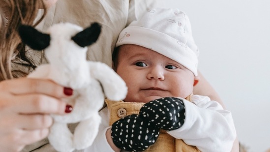 Mittens made from good quality fabric help in protecting babies from winter chill. (Pexels)