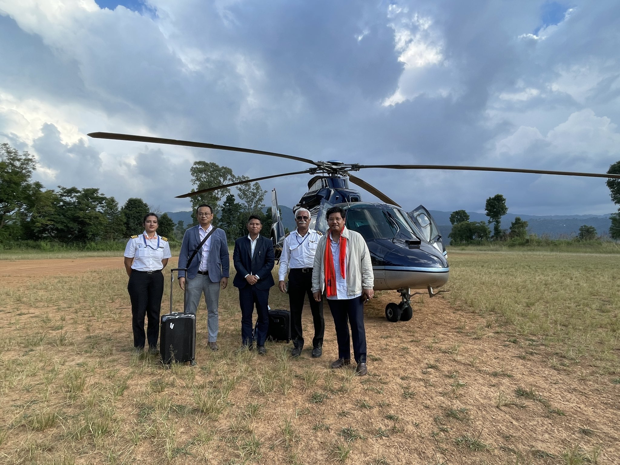 Meghalaya CM Conrad Sangma with the captain and pilot of the helicopter after an emergency landing near Umiam lake due to bad weather. (Twitter: @SangmaConrad) Meghalaya CM Conrad Sangma with the captain and pilot of the helicopter after an emergency landing near Umiam lake due to bad weather. (Twitter: @SangmaConrad)