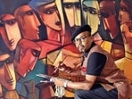 Artist Paresh Maity with his artwork. Artist Paresh Maity with his artwork.