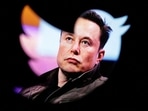 FILE PHOTO: Elon Musk's photo is seen through a Twitter logo in this illustration. 