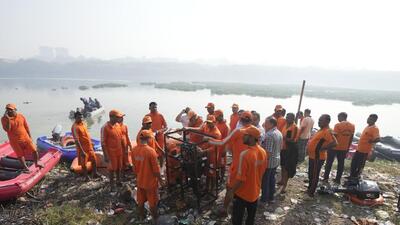 NDRF personnel prepare to leave on a search mission in the Machchhhu river, the site of a cable bridge that collapsed on Sunday, in Morbi town of western state Gujarat, India, Wednesday, Nov. 2, 2022. A century-old cable suspension bridge collapsed into the river Machchhu on Sunday evening, sending hundreds plunging in the water in one of the country's worst accidents in years. (AP Photo/Ajit Solanki) (AP) NDRF personnel prepare to leave on a search mission in the Machchhhu river, the site of a cable bridge that collapsed on Sunday, in Morbi town of western state Gujarat, India, Wednesday, Nov. 2, 2022. A century-old cable suspension bridge collapsed into the river Machchhu on Sunday evening, sending hundreds plunging in the water in one of the country's worst accidents in years. (AP Photo/Ajit Solanki) (AP)