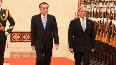 Pakistan's Prime Minister Shehbaz Sharif, with Chinese Premier Li Keqiang, inspects the honour guard during his two days visit in Beijing (via REUTERS) Pakistan's Prime Minister Shehbaz Sharif, with Chinese Premier Li Keqiang, inspects the honour guard during his two days visit in Beijing (via REUTERS)