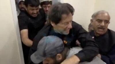 Former Pakistani Prime Minister Imran Khan is helped after he was shot in the shin in Wazirabad, Pakistan (Urdu Media via REUTERS) Former Pakistani Prime Minister Imran Khan is helped after he was shot in the shin in Wazirabad, Pakistan (Urdu Media via REUTERS)