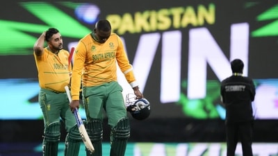 South Africa's Tabraiz Shamsi, left, and teammate Lungi Ngidi walk from the field following their loss to Pakistan in their T20 World Cup cricket match in Sydney, Australia, Thursday, Nov. 3, 2022. (AP Photo/Rick Rycroft) (AP)